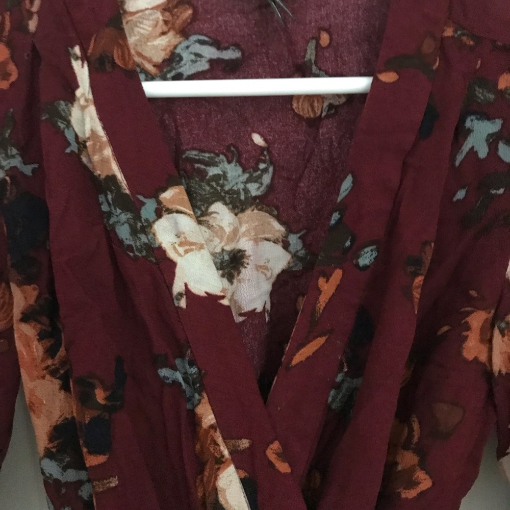 Anthropology red floral wrap blouse.